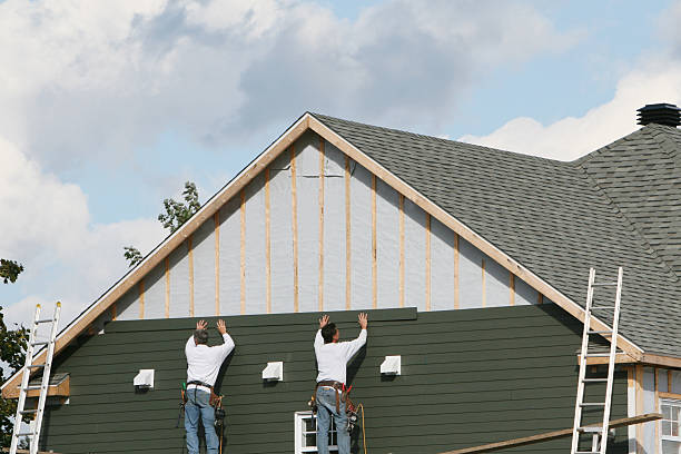 Professional Storm Damage Siding Repair technician working in Pitcairn, PA